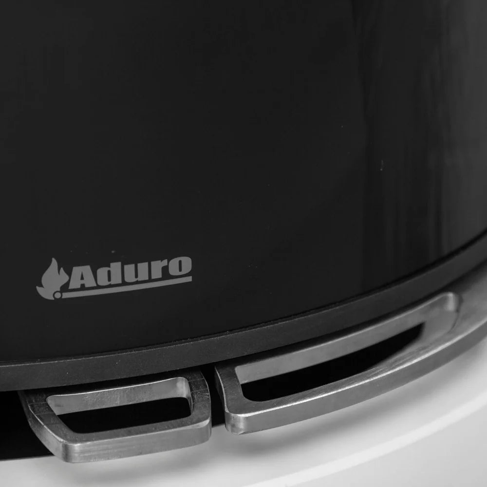 Närbild på den svarta glasfronten och de integrerade luftreglagen på Aduro 9 Lux Ceramic